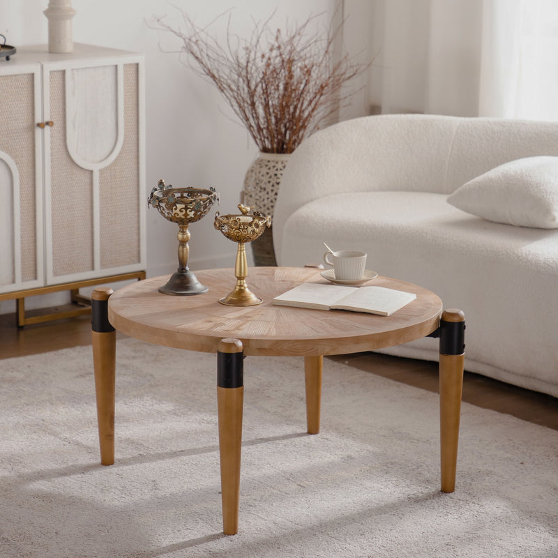 Round radial-pattern coffee table with tapered legs and black accents