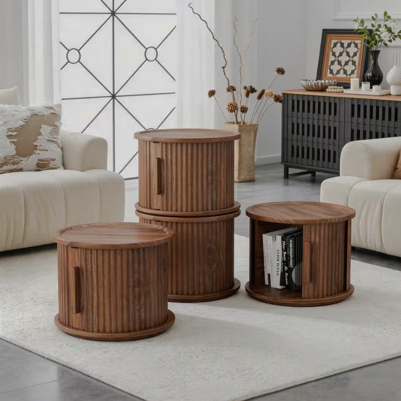 Four fluted brown storage tables arranged around a living room, with one open and two stacked