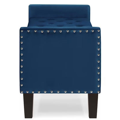 End view of the navy storage bench with a low arm and nailhead trim