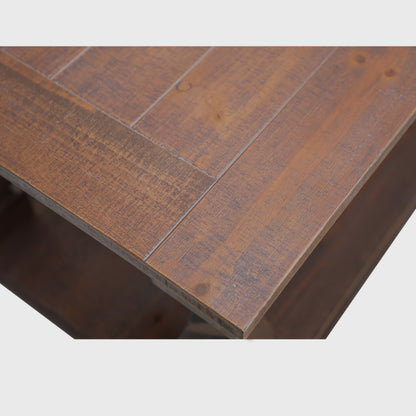 Detail of the walnut-brown coffee table's planked-look top