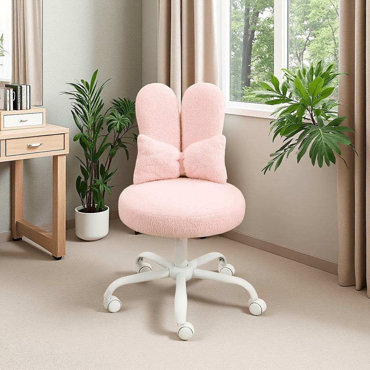 Pink bunny ear vanity chair with a bow cushion and white rolling base