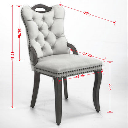Gray velvet dining chair with a tufted back, wood handle, and curved wood legs — dimension diagram