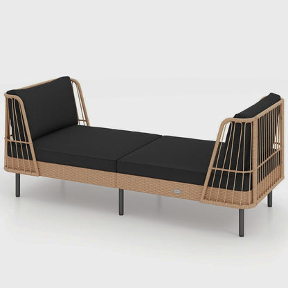 Wicker-style outdoor daybed with black cushions isolated on white