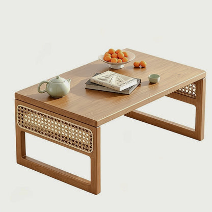 Natural bamboo low table with woven panels isolated on white