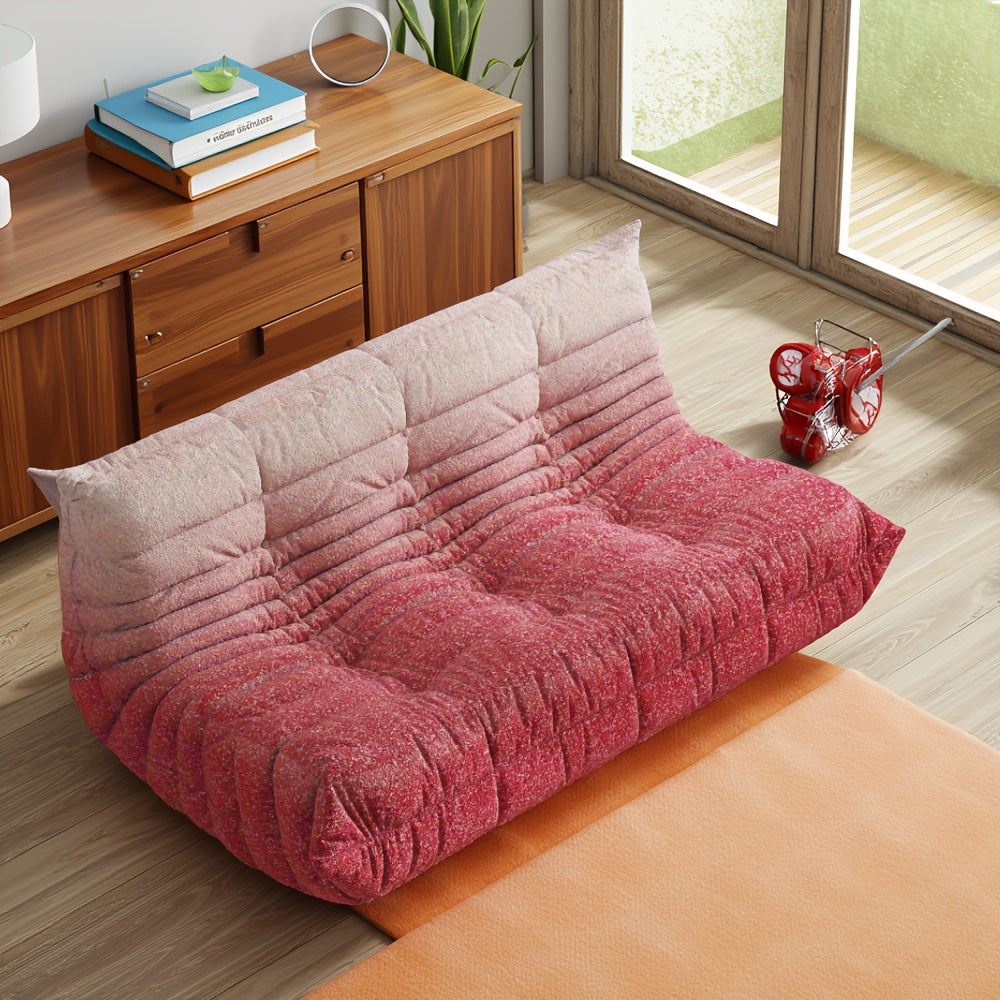 Overhead angled view of a red-and-white gradient floor sofa