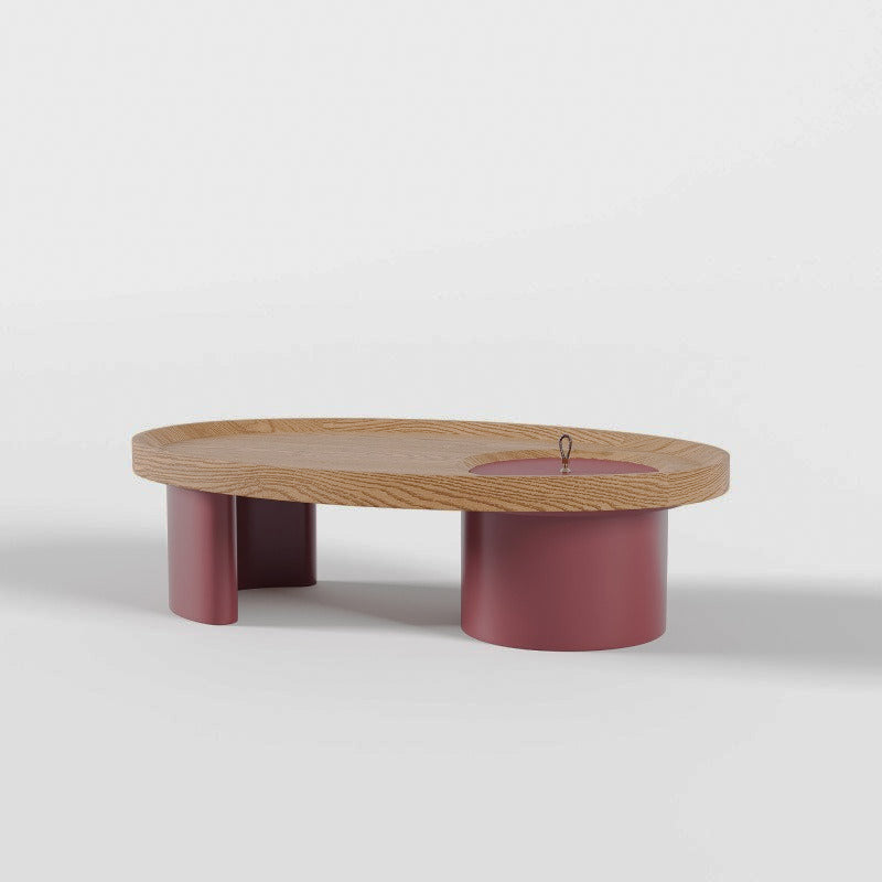 Oval storage coffee table with red supports on a white background