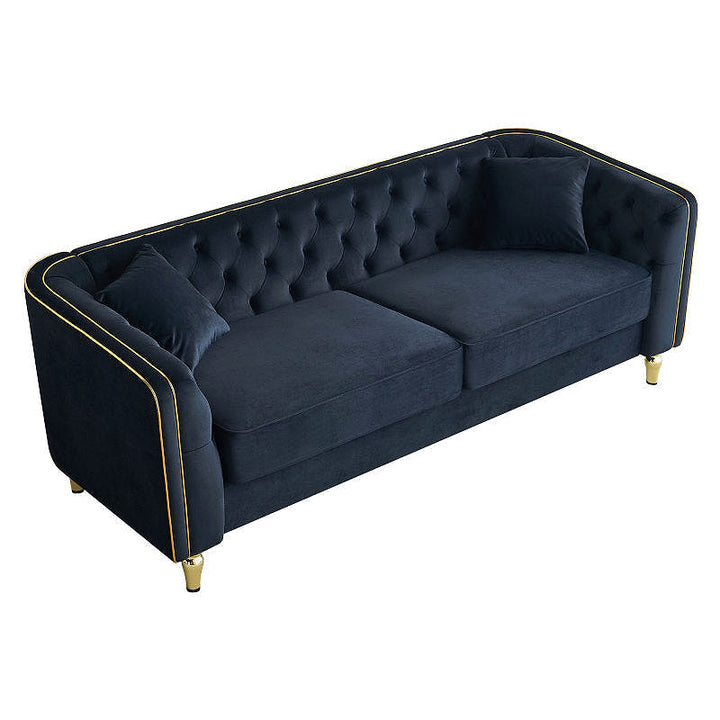 Black tufted sofa with two seat cushions, elevated angled view