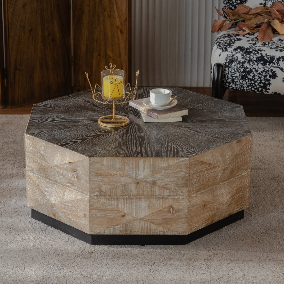 Octagonal coffee table with a dark top, light faceted sides and black plinth