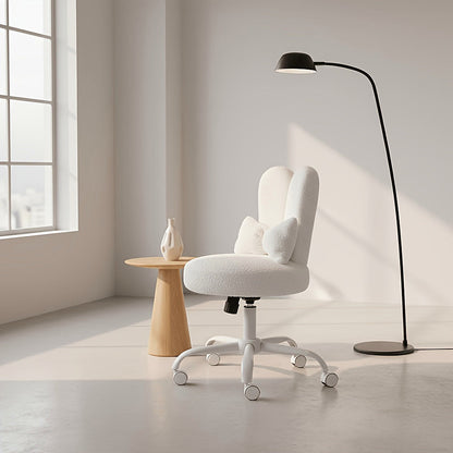 White bunny ear vanity chair with a bow cushion and white rolling base