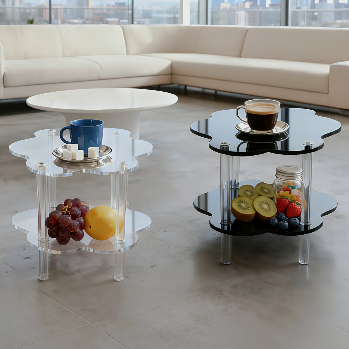 Clear and black cloud-shaped acrylic side tables shown together