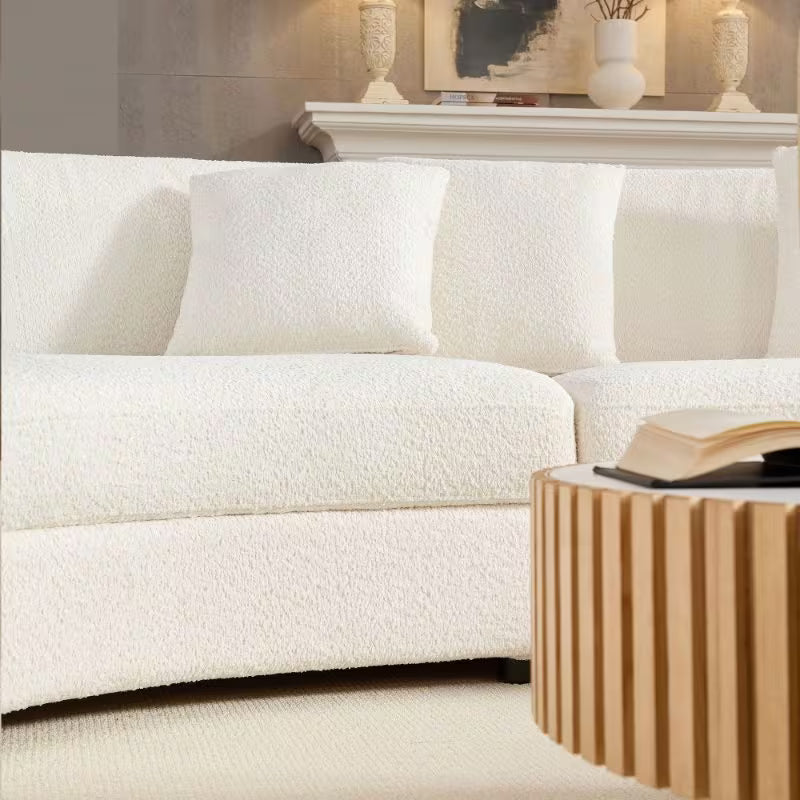 Ivory Curved Sofa with Four Pillows — seat, base and pillow detail.