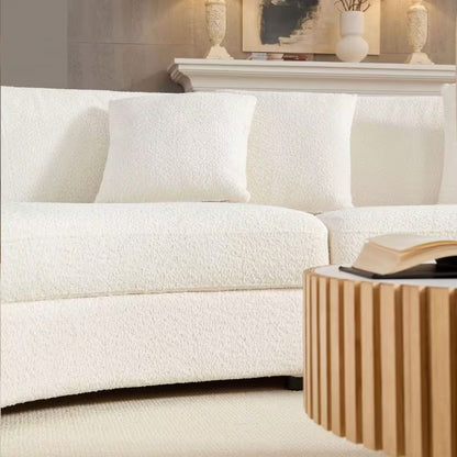 Ivory Curved Sofa with Four Pillows — seat, base and pillow detail.