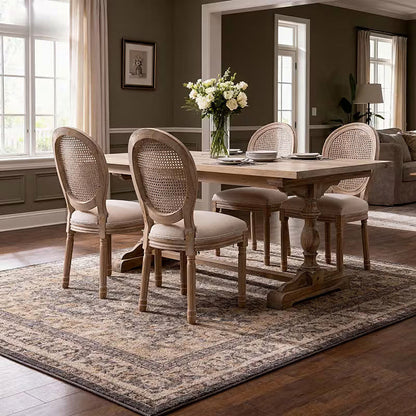 French style dining chair with a woven rattan back and beige upholstered seat