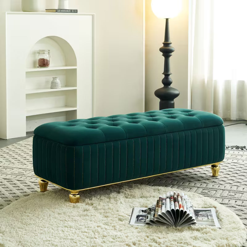 Green button-tufted storage bench pictured in a living room beside a rug