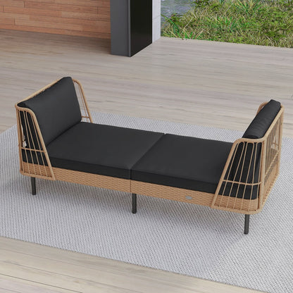 Angled view of long wicker daybed with black cushions