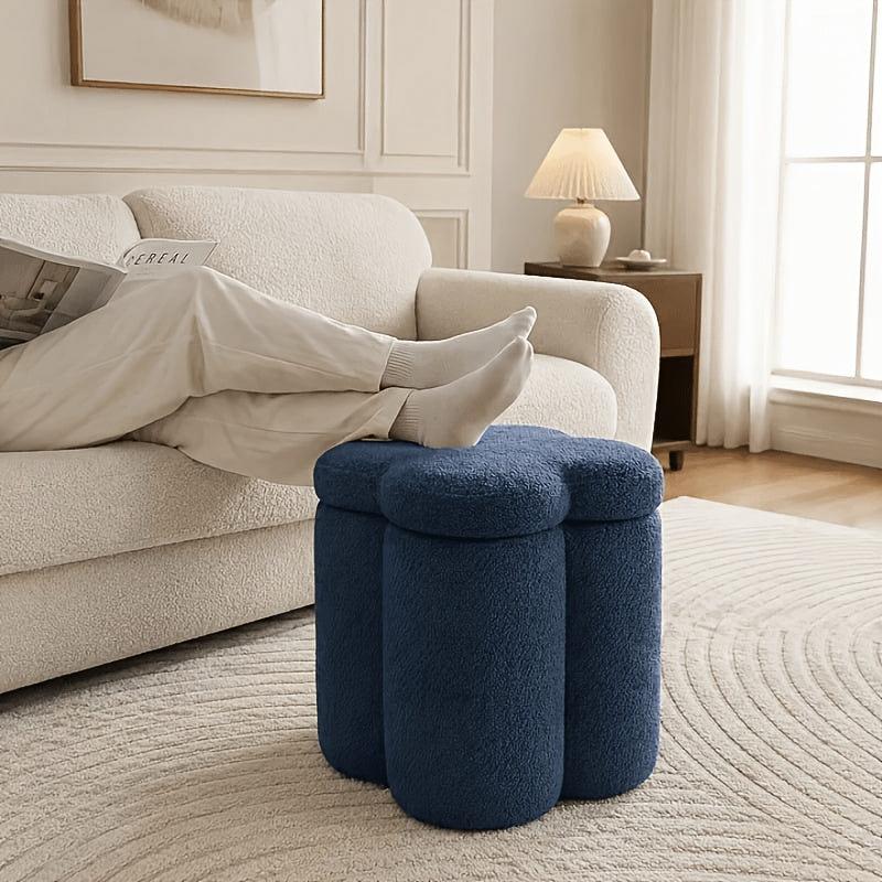 Flower-Petal Chenille Storage Ottoman — navy ottoman beside a sofa