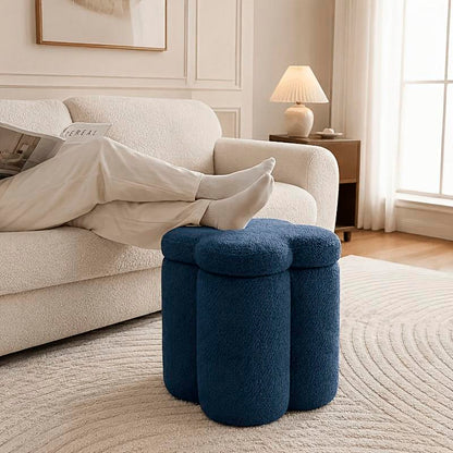 Flower-Petal Chenille Storage Ottoman — navy ottoman beside a sofa