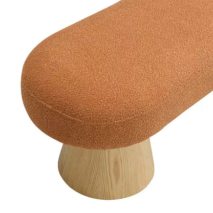 Orange textured upholstery on the bouclé-style bench