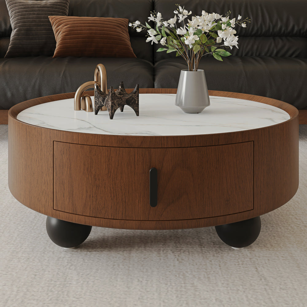 Round marble-look storage coffee table with walnut-look sides and black ball feet