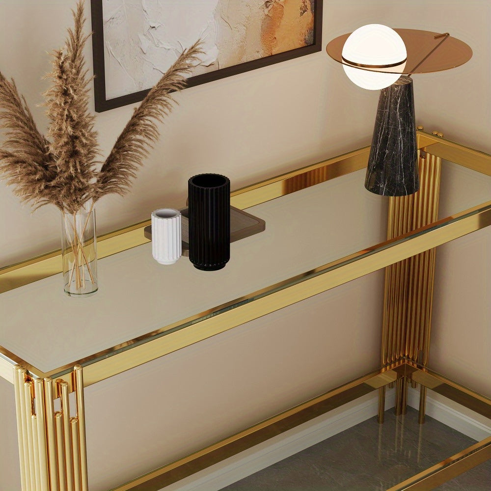 High angle showing the reflective glass console top with decorative accessories