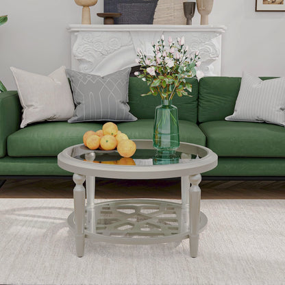 Champagne round glass-top coffee table with geometric lower shelf