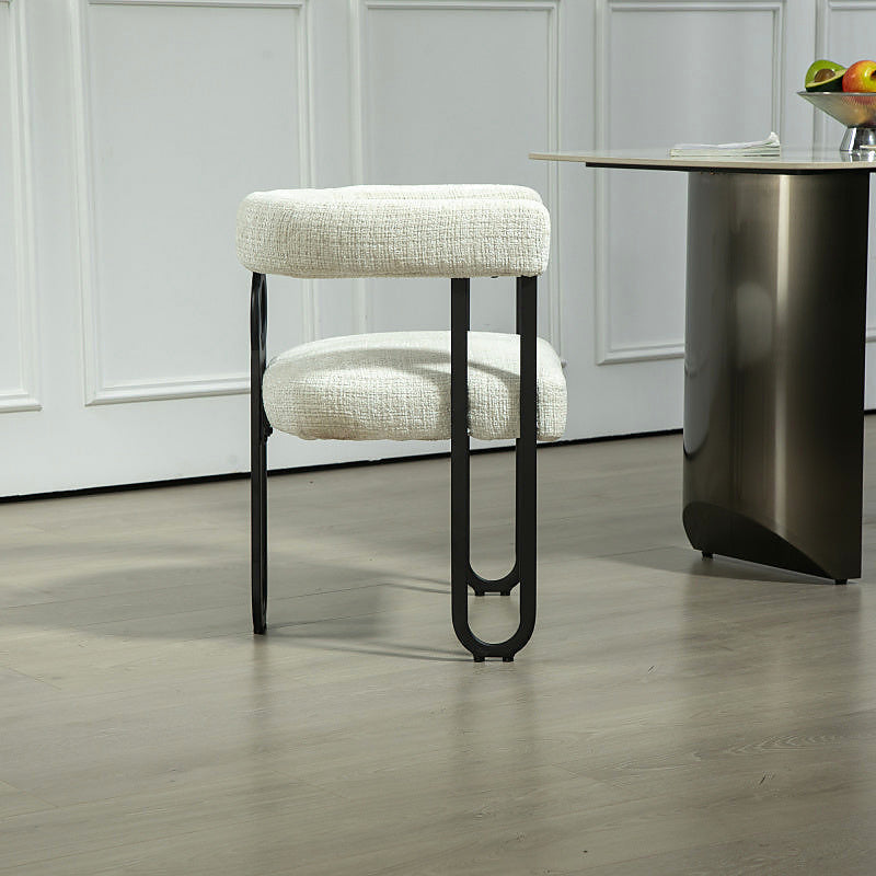 Beige chenille dining chair with a black metal loop frame
