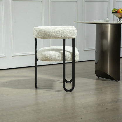 Beige chenille dining chair with a black metal loop frame
