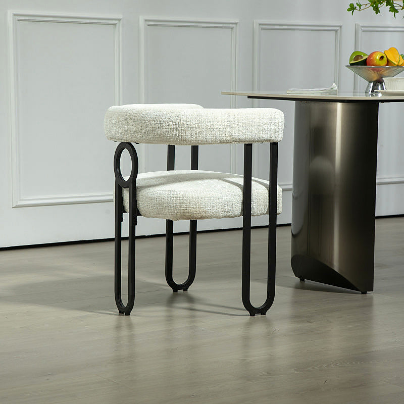 Beige chenille dining chair with a black metal loop frame