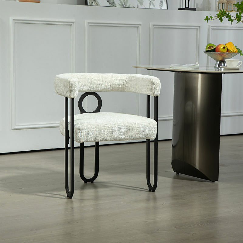 Beige chenille dining chair with a black metal loop frame