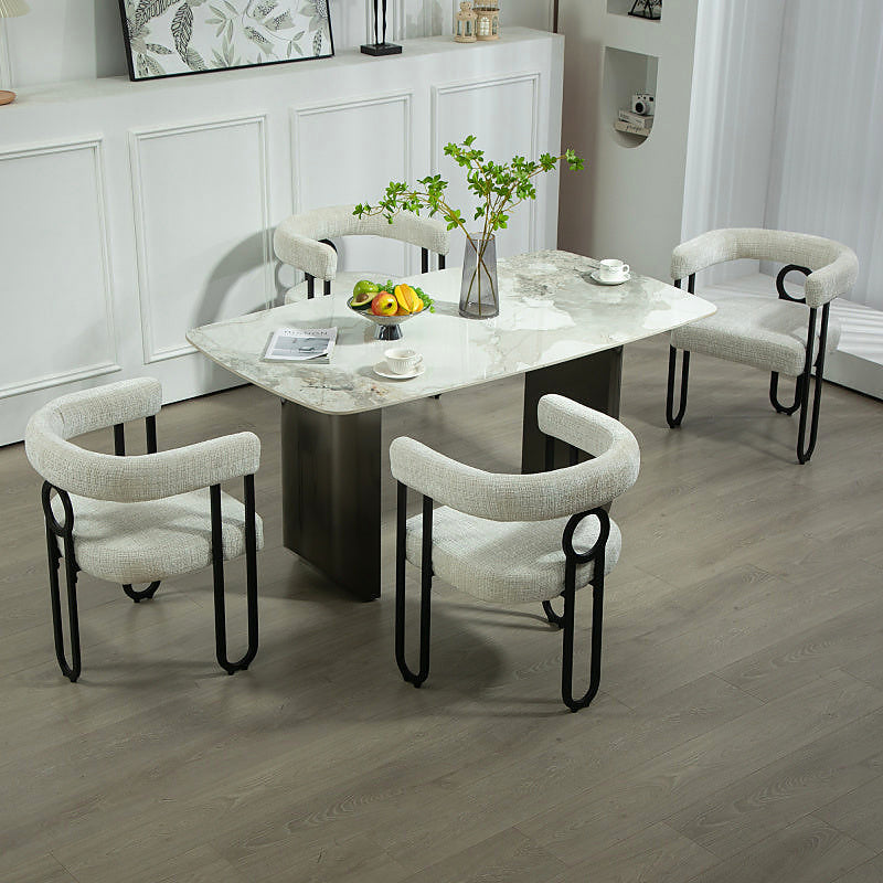 Beige chenille dining chair with a black metal loop frame