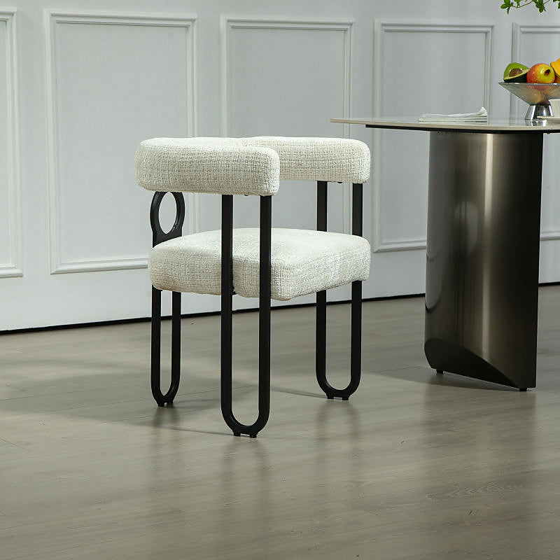 Beige chenille dining chair with a black metal loop frame