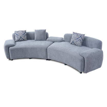 Blue-Grey Curved Sofa with Damask Pillows — angled product view of both modules.