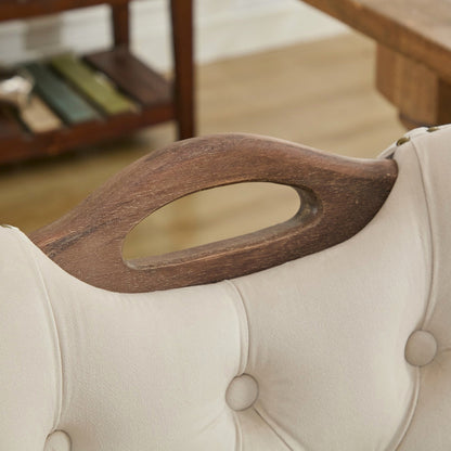 Beige velvet dining chair with a tufted back, wood handle, and curved wood legs