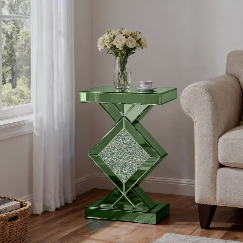 Green mirrored accent table with a geometric base and sparkling decorative inlay