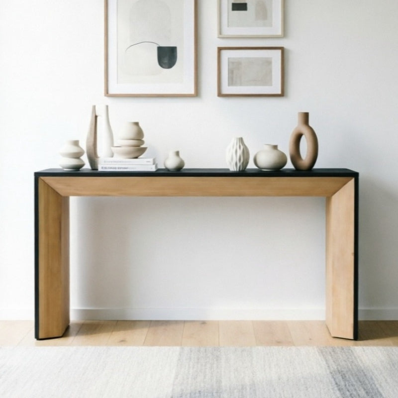 Front view of the brown-and-black console styled against a white wall.