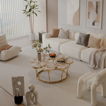 Angled view of a flower-shaped coffee table with a veined top and gold-tone frame