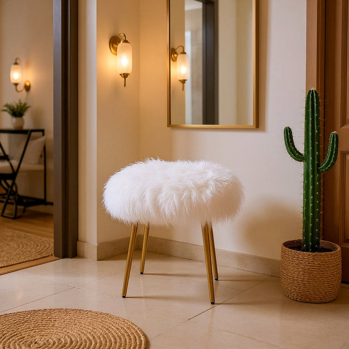 White faux fur stool with gold-tone legs in entryway