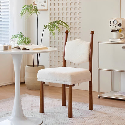 Ivory textured dining chair with a turned wood frame