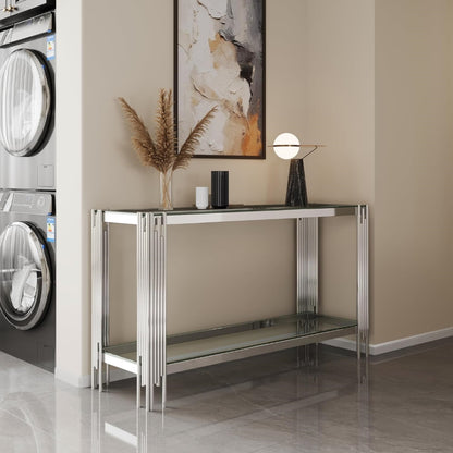 Angled room view of the clear glass and silver frame console.