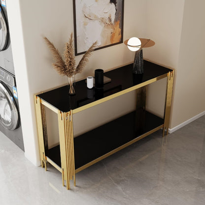 Black glass and gold frame two-tier console styled in an entryway.