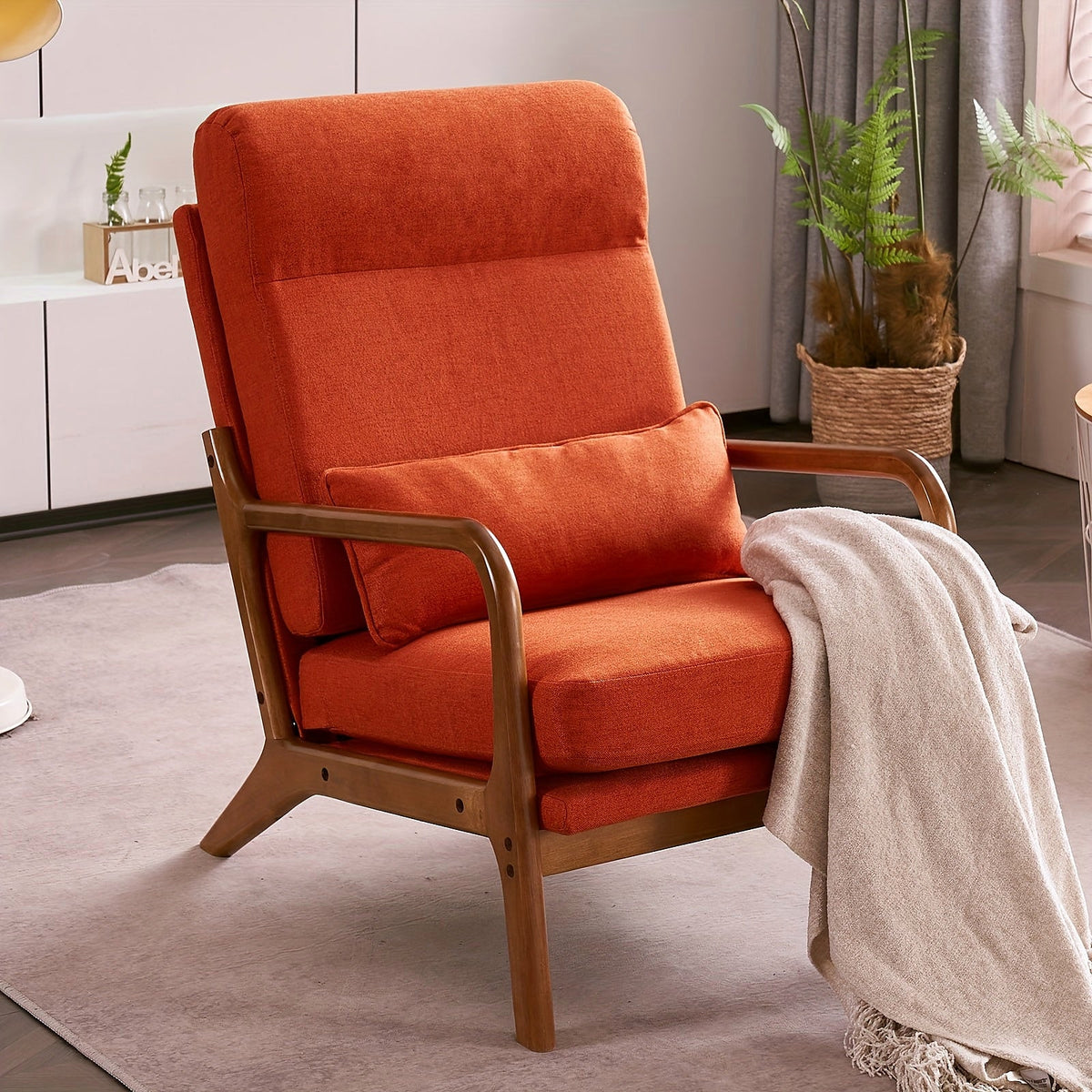 Burnt orange linen high back upholstered lounge chair with a warm wood frame