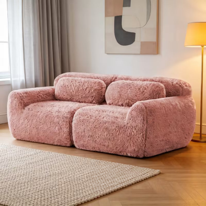 Plush Modular Two-Seat Sofa — pink sofa angled room view.
