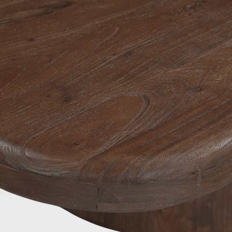 Close-up of the rounded edge and wood grain on the coffee tabletop