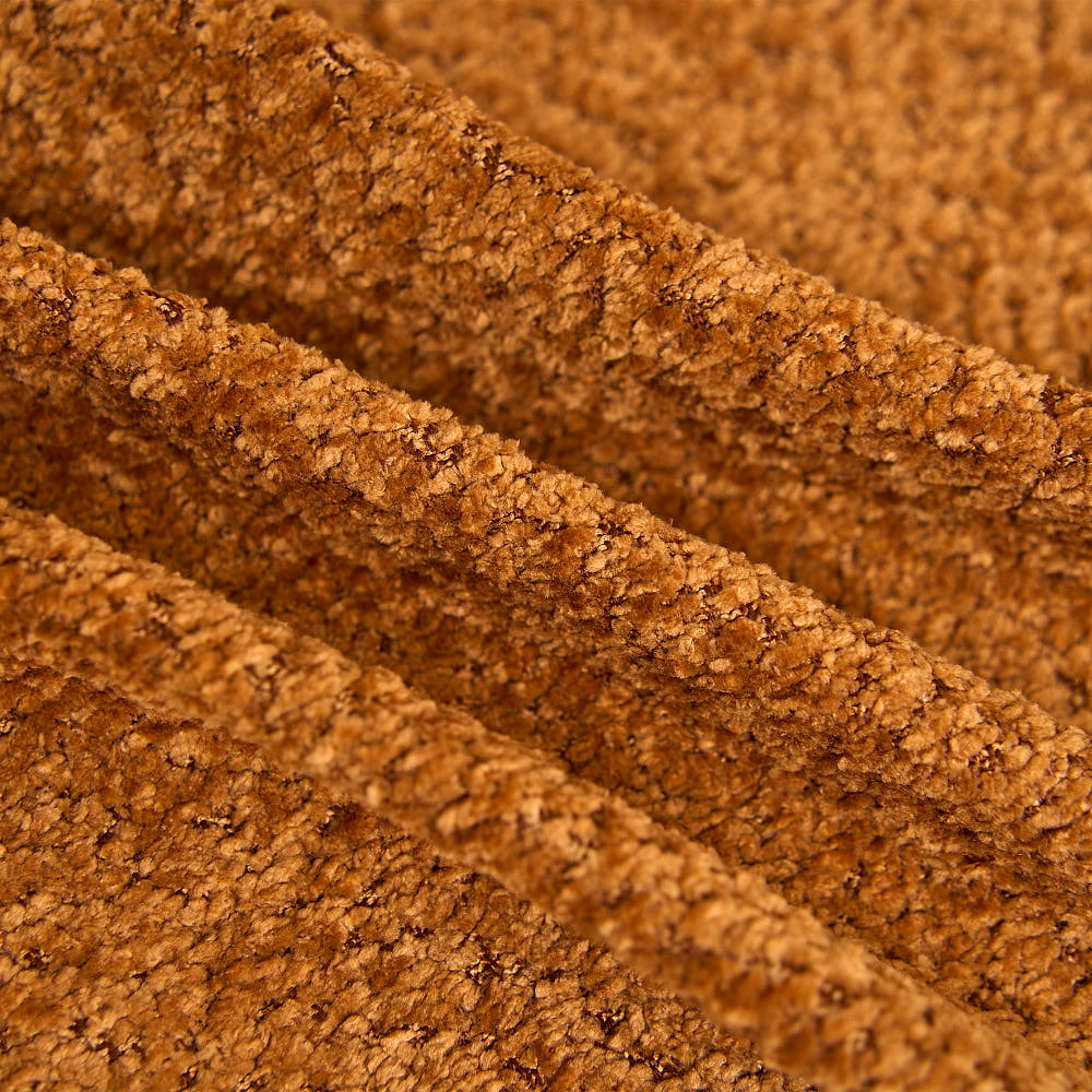 Close-up of the caramel chenille upholstery texture.