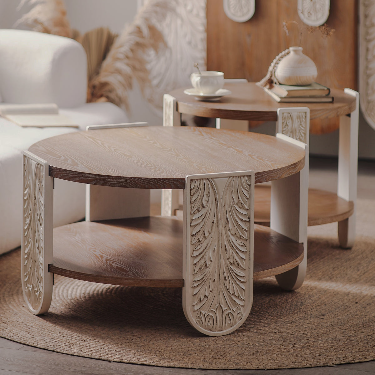 Round coffee table with leaf motifs and open lower shelf