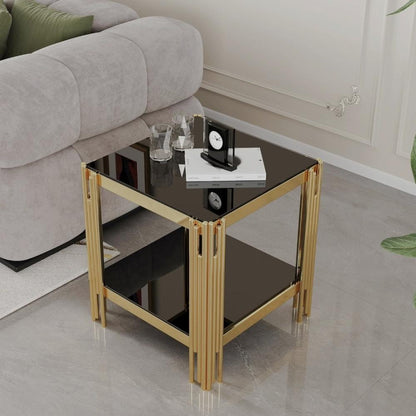 Square two-tier end table with black reflective shelves and a gold-tone frame beside a gray sofa