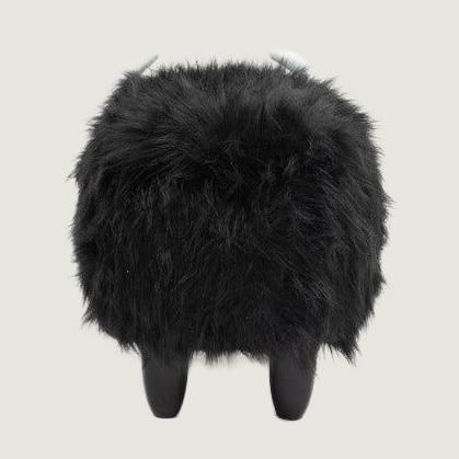 Harry Black Buffalo Storage Ottoman — complete rear view on a light neutral studio background