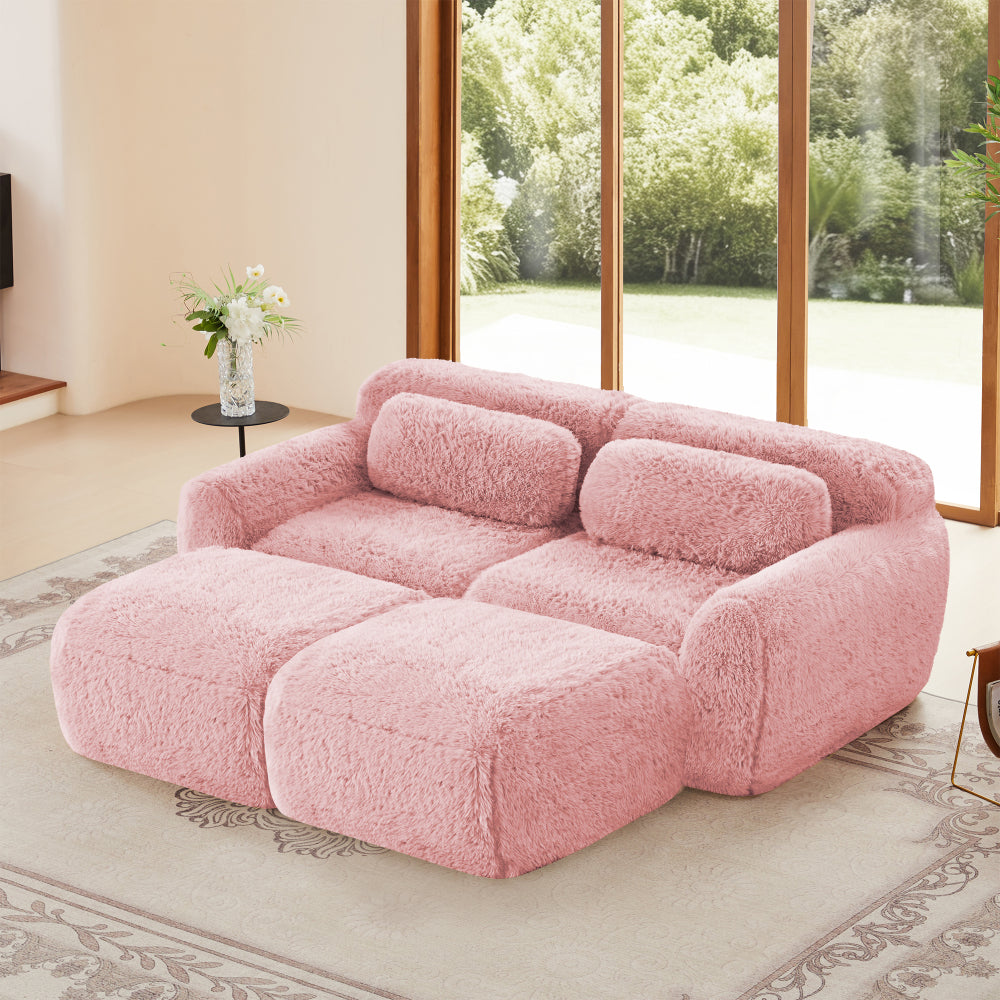 80-Inch Plush Deep-Seat Sofa with Footrests — pink sofa and front footrest sections in a room