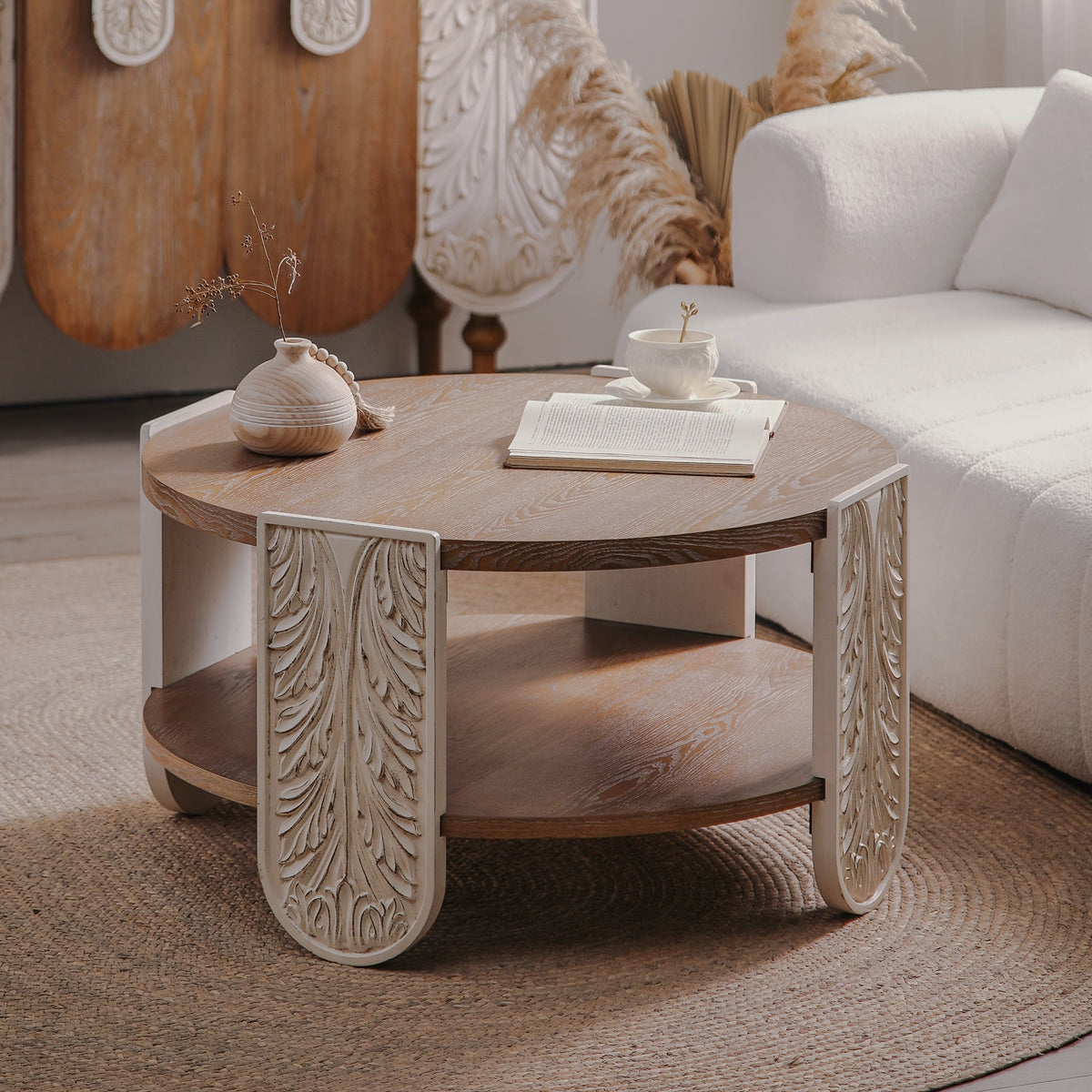 Angled view of carved-leg round two-tier coffee table