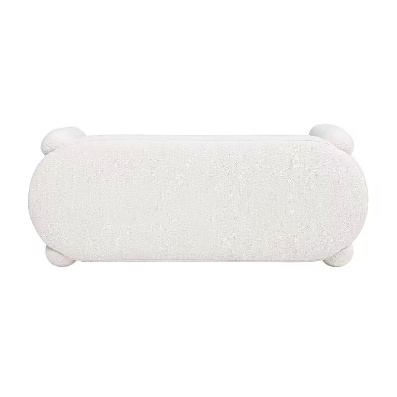 Top view of the cream oval bouclé-style bench